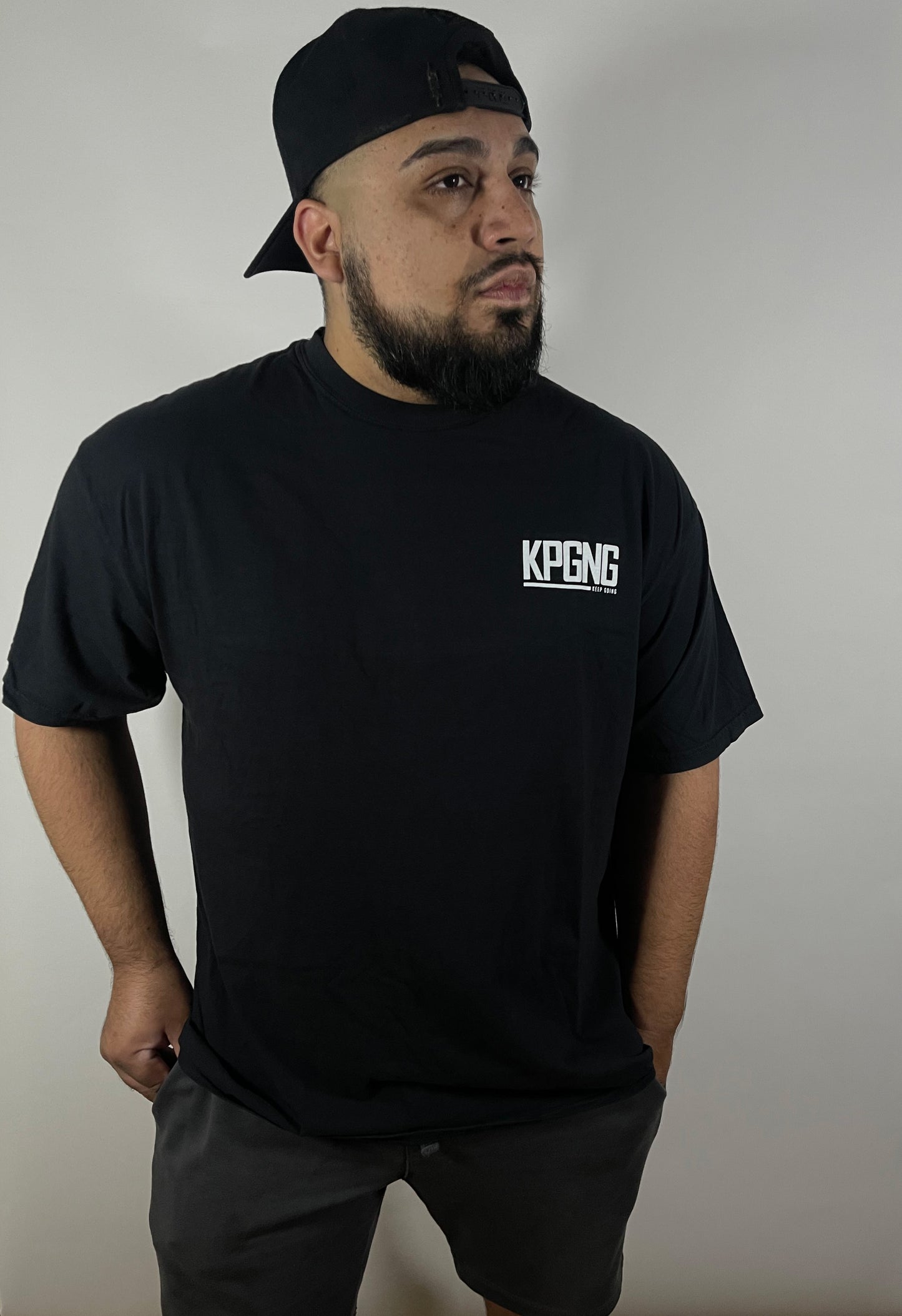 man wearing kpgng black shirt